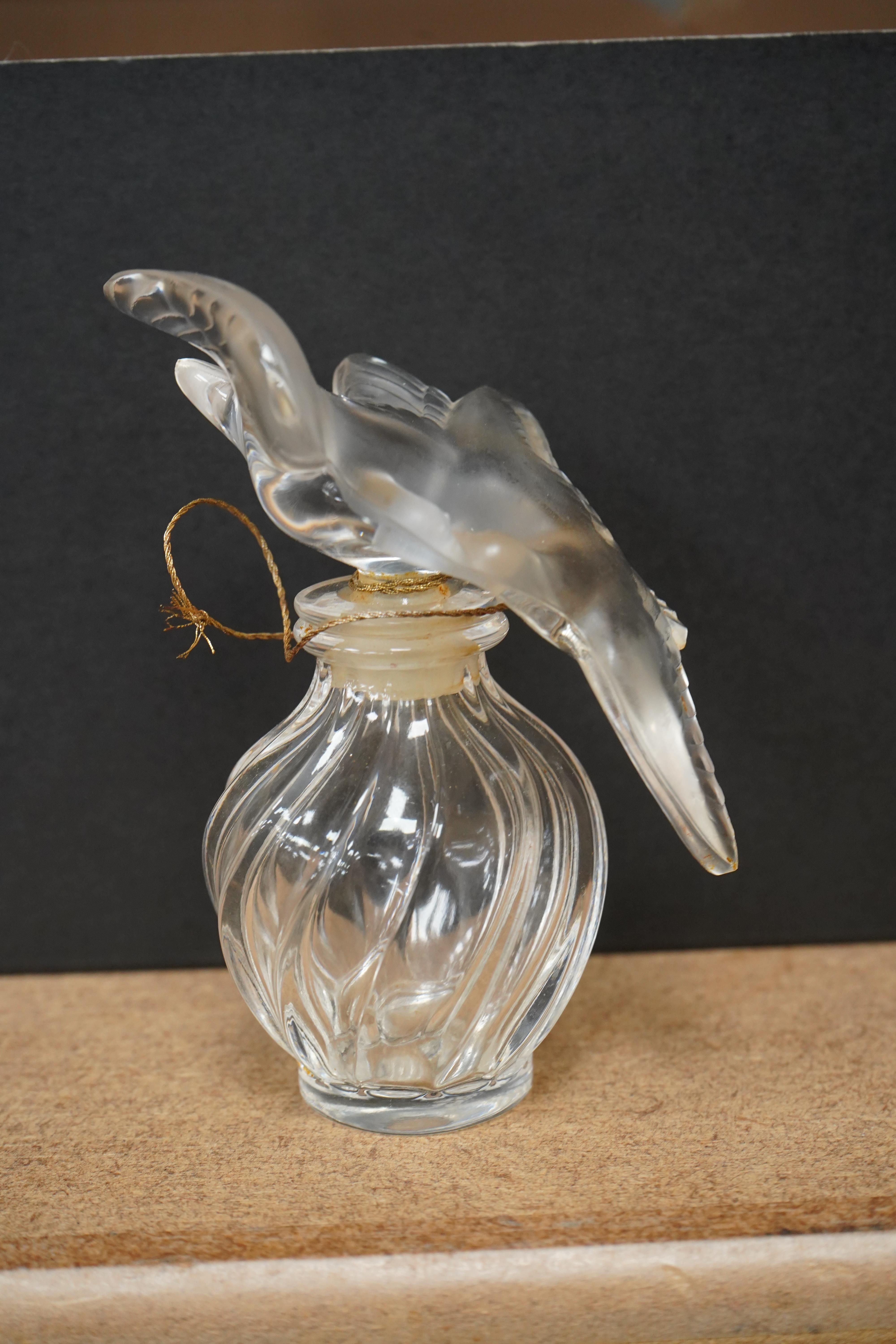 A Lalique scent bottle, Nina Ricci l'airs du temps, 10.5cm tall
